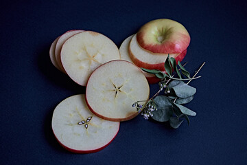 apple slices on a blue background. apple, wedge, piece, eucalyptus, cracker