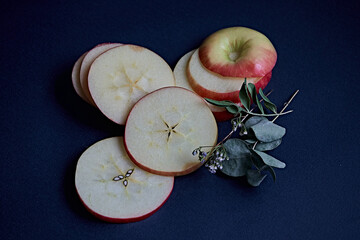 apple slices on a blue background. apple, wedge, piece, eucalyptus, cracker