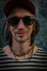 Bearded man portrait near old stone brick wall