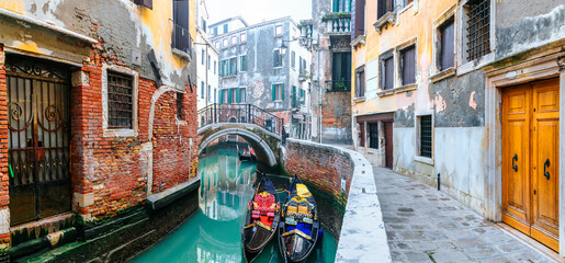 Most beautiful and romantic town Venice, Italy. Panoramic view of narrow canals streets and gondolas boats