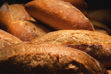Lots of French bread rolls. Freshly baked French rolls are delicious. Close-up