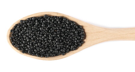 Black beluga lentils pile in wooden spoon isolated on white background, top view