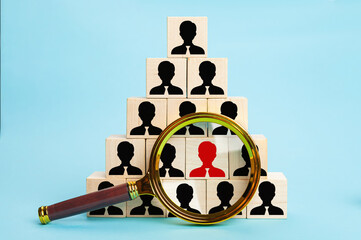 The concept of talent search or magnifying glass looking for employees, building a strong team, the...