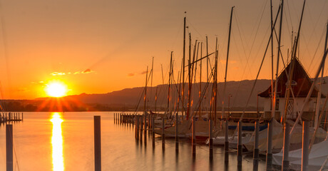 Jetty at sunrise in the harbour of Lindau