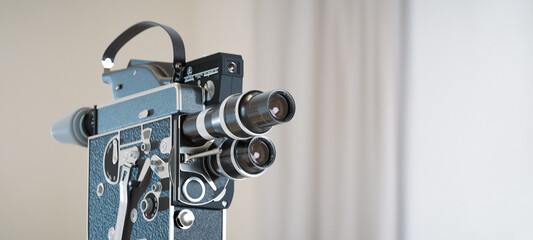 Vintage 16 mm movie camera with two lenses. State of the art retro design perfect as background...