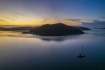 Fototapeta na wymiar Aerial sunrise waterscape with boats