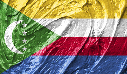 Comoros flag on watercolor texture. 3D image