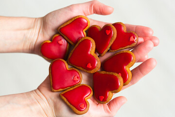Homemade cookies with red sugar glaze in shape of hearts for the Valentine's Day