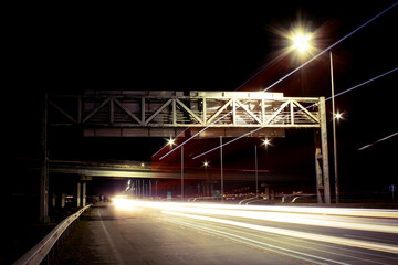 Fototapeta na wymiar Night scene with traffic light trails. Autobahn view at night.