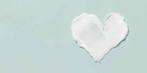 A smear of cosmetic cream on a blue background