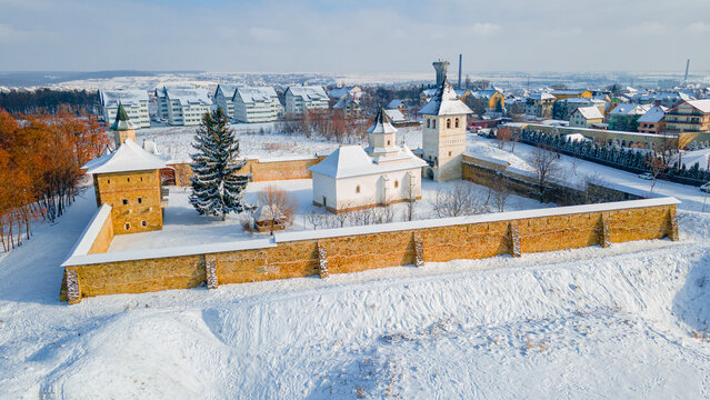 Aerial photography of Zamca monastery, located in Suceava county, Romania in winter season. Photography was taken from a drone with camera pointing downwards at a lower angle.