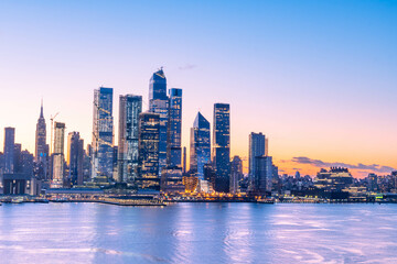 Vivid Manhattan skyline taken right before sunrise, wonderful architecture in low light, long exposure technique.