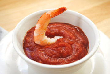 Appetizer of Shrimp Dipped in Cocktail Sauce	