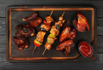Mixed barbecue of chicken wings and beef ribs