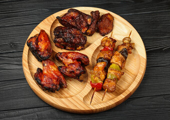 Mixed barbecue of chicken wings and beef ribs