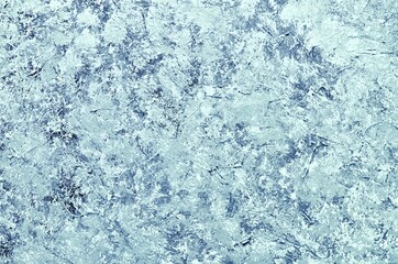 The texture of a concrete or plastered wall for the background.