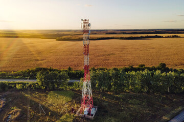 Cell site of telephone tower with 5G base station transceiver. Aerial view of telecommunication...