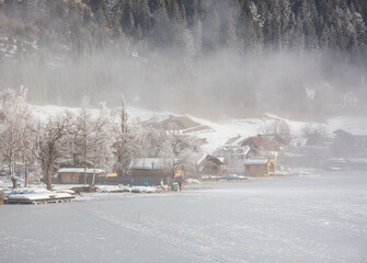 foggy morning in winter above  the village