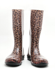 Women's rubber boots with leopard patterns on a white background