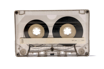 An old transparent audio cassette for a tape recorder isolated on a white background