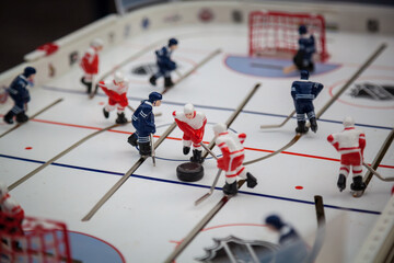 Board game hockey close-up. Blue and red players.