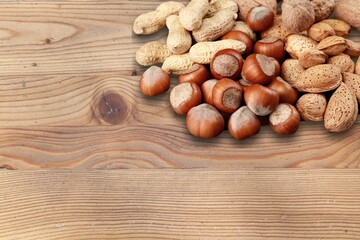 Roasted chestnuts, autumn food on a rustic wooden background