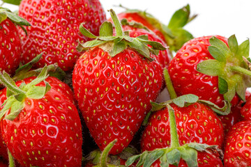 beautiful and ripe red strawberries on a white background