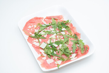 albese with parmesan oil and rocket