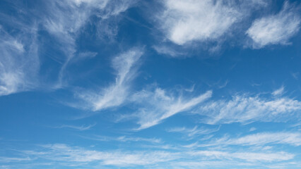 Naklejka na ściany i meble WIspy clouds and blue sky suitable for background or sky replacement