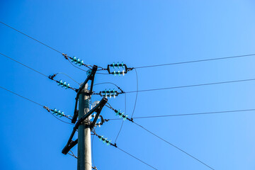 Power lines and a clear blue sky as an electricity and energy concept 