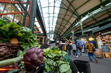 Market stalls at Borough Market, partially covered urban market in Southwark, east London, with a...