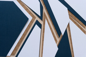 abstract paper background mostly composed with triangular shaped paper in white, blue, or brown