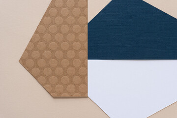 abstract paper background mostly composed with triangular shaped paper in white, blue, or brown