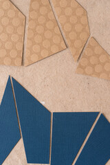 abstract paper background mostly composed with triangular shaped paper in white, blue, or brown