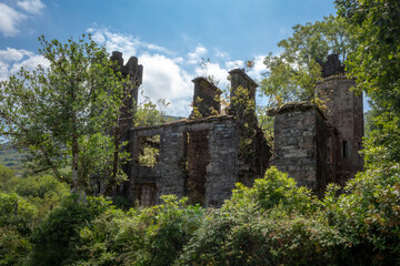 Fototapeta na wymiar Ruin of Mulgrave Barracks Surrounded by Trees, Killarney, County Kerry