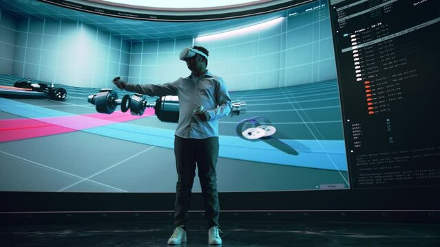 Automotive Engineer Making Presentation of a Modern VR Software Testing and Developing Vehicle Platforms. Engineer Uses Headset and Controllers to Showcase Functionality on a Big Screen on Stage.