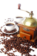 Old coffee grinder with white cup