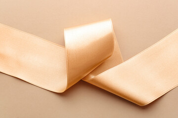 Golden ribbon on color background