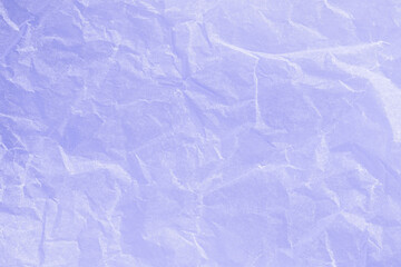 Rumpled light purple paper texture background close-up