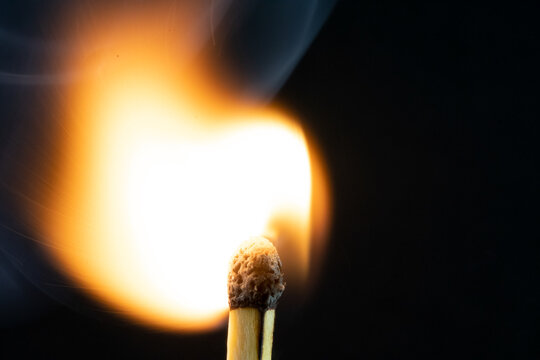 view of a match stick flame flare as it is lit