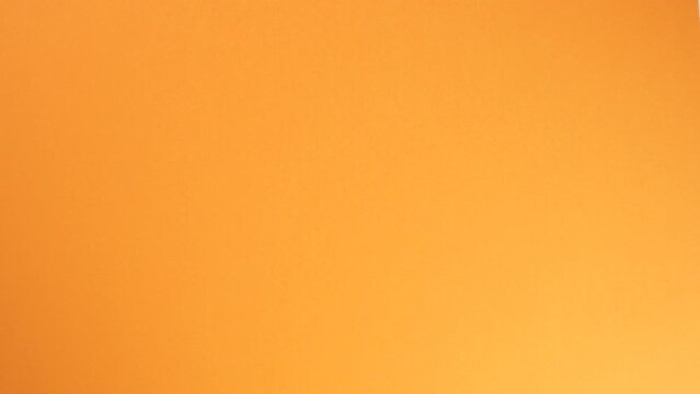 Top view of hot coffee cup on orange table. mug isolate Espresso in dark cup. flat lay coffee cup on white desktop. Place for text. A woman's hand takes a cup from a small plate. put back on a saucer.