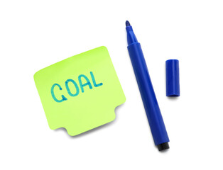 Sticky note with word GOAL and marker on white background