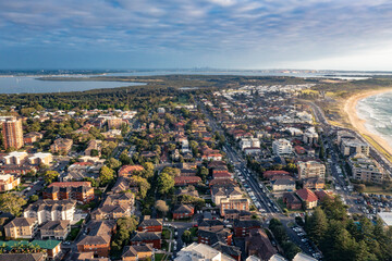 Panoramic aerial drone view of Cronulla in the Sutherland Shire, South Sydney, looking toward North Cronulla Beach during summer in the early morning  