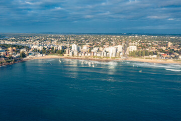 Aerial drone view of Cronulla and Cronulla Beach in the Sutherland Shire, South Sydney during summer in the early morning  