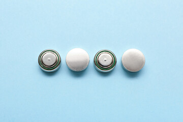 Lithium button cell batteries on blue background