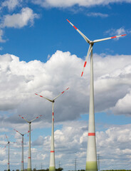 renewable energy, landscape with wind mill, wind mill park, wind mills standing in a line