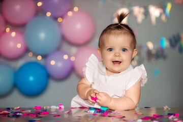 Happy one year old baby with birthday cake. Children's birthday
