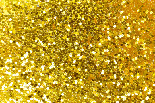 Yellow confetti sparkle. The texture glitters with golden sequins. Lots of scattered shiny circles.