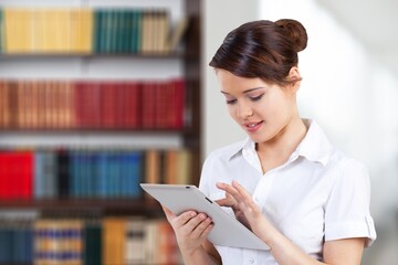 Young smiling businesswoman student girl holding using tablet device surfing social media