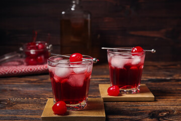 Glasses of tasty Manhattan cocktail on table